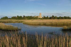 Blythburgh Holy Trinity Church (The Cathedral of the Marshes) across the River Blyth reedbeds